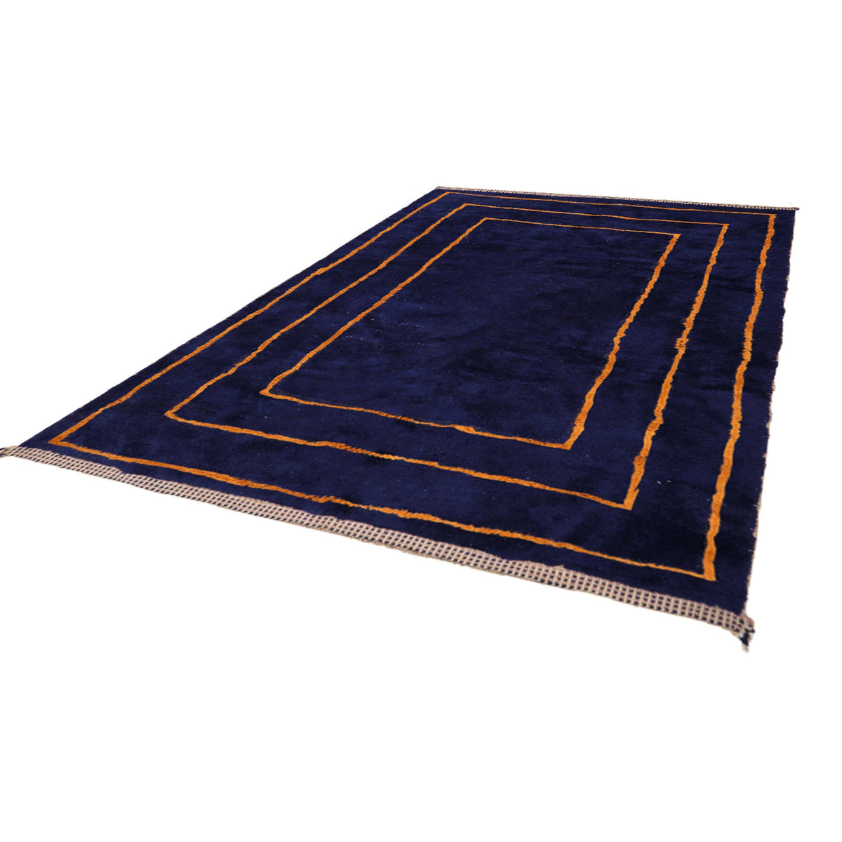 Detail of Mrirt wool rug, orange geometric frames on a deep blue wool ground