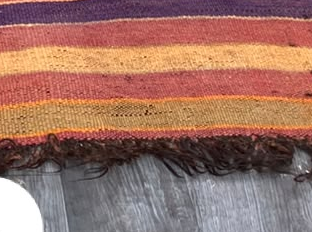Fringe and edge detail of Rust Red Vintage Moroccan Rug with Stepped Medallion, 294 × 162 cm.