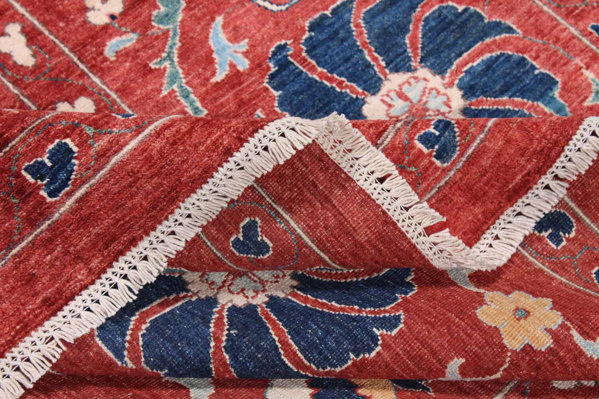 Close-up of the red Suzani wool rug with floral medallion, 318 × 264 cm, detail 8.
