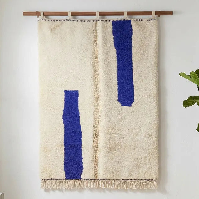 Front view of Beni Ourain wool rug, two deep blue bars on a cream wool ground