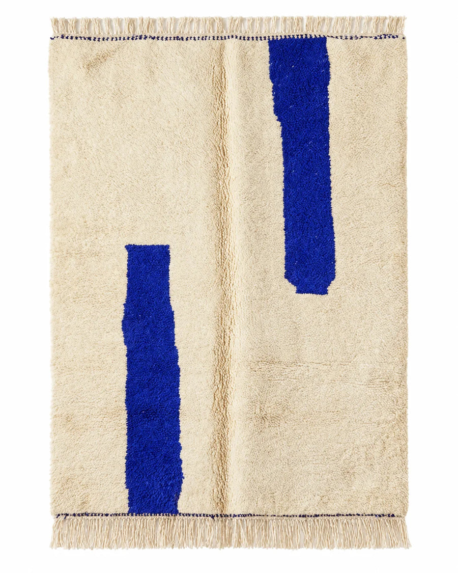Front view of Beni Ourain wool rug, two deep blue bars on a cream wool ground
