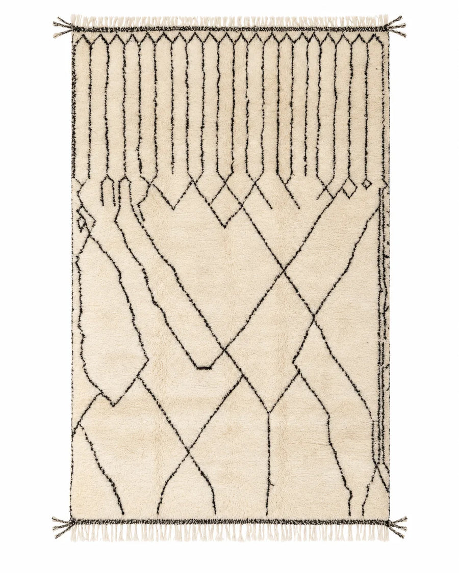 Front view of Mrirt wool rug, black grid leading into irregular diamonds on a cream ground