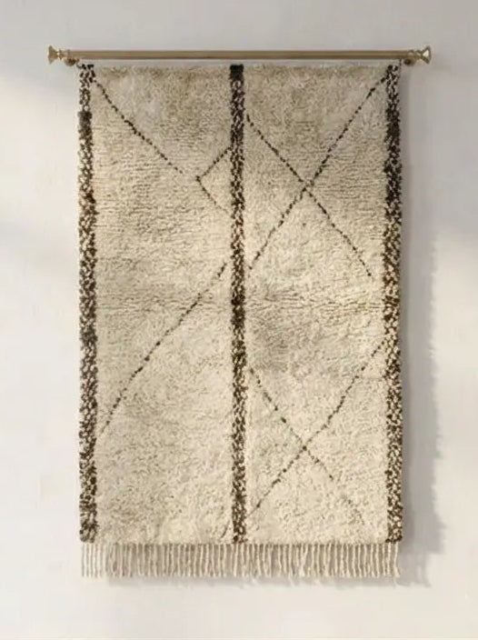 Front view of Beni Ourain wool rug, dark brown vertical lines and diamonds on a light ground