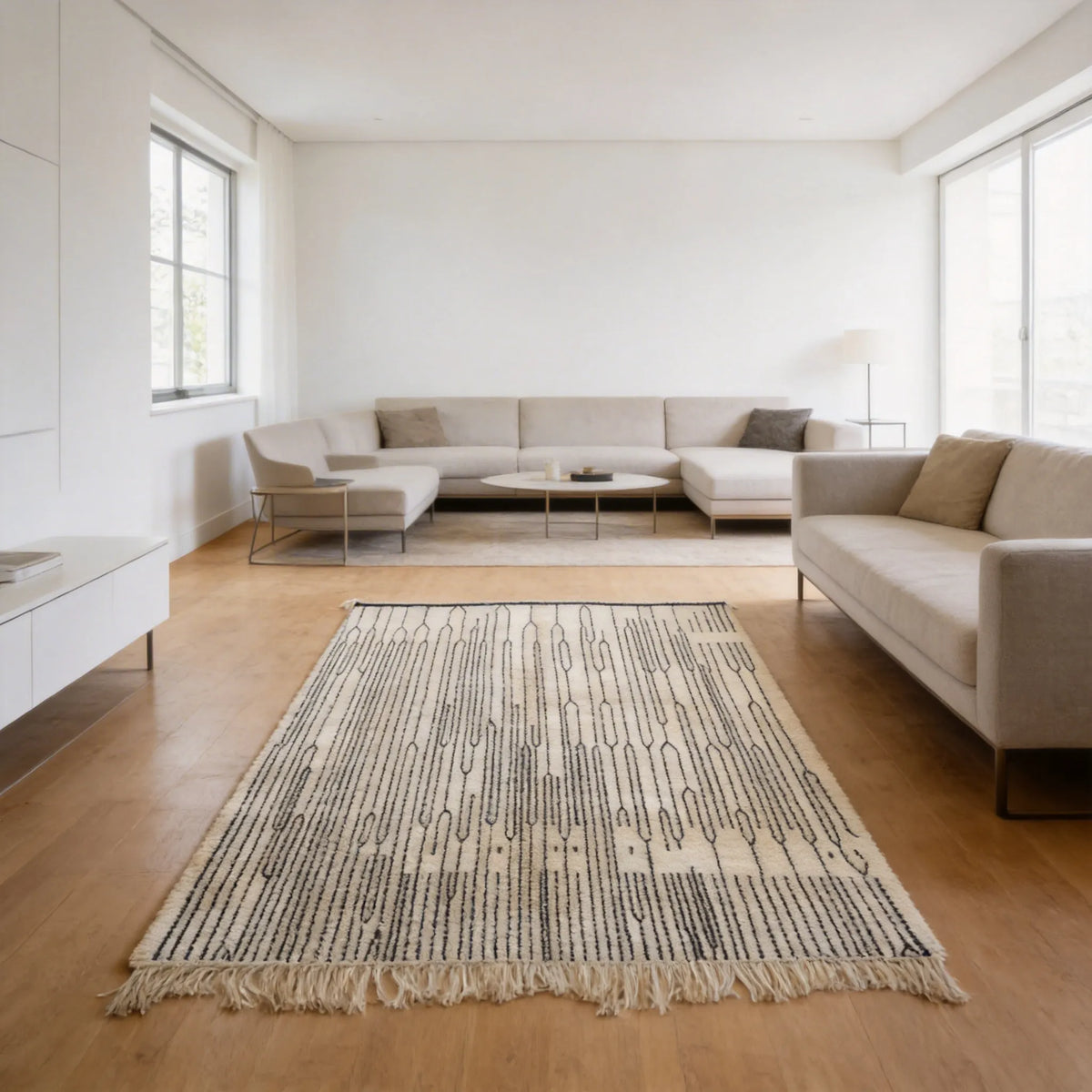 Mrirt wool rug, fine black stripes and narrow diamonds on a cream wool ground in a living room setting