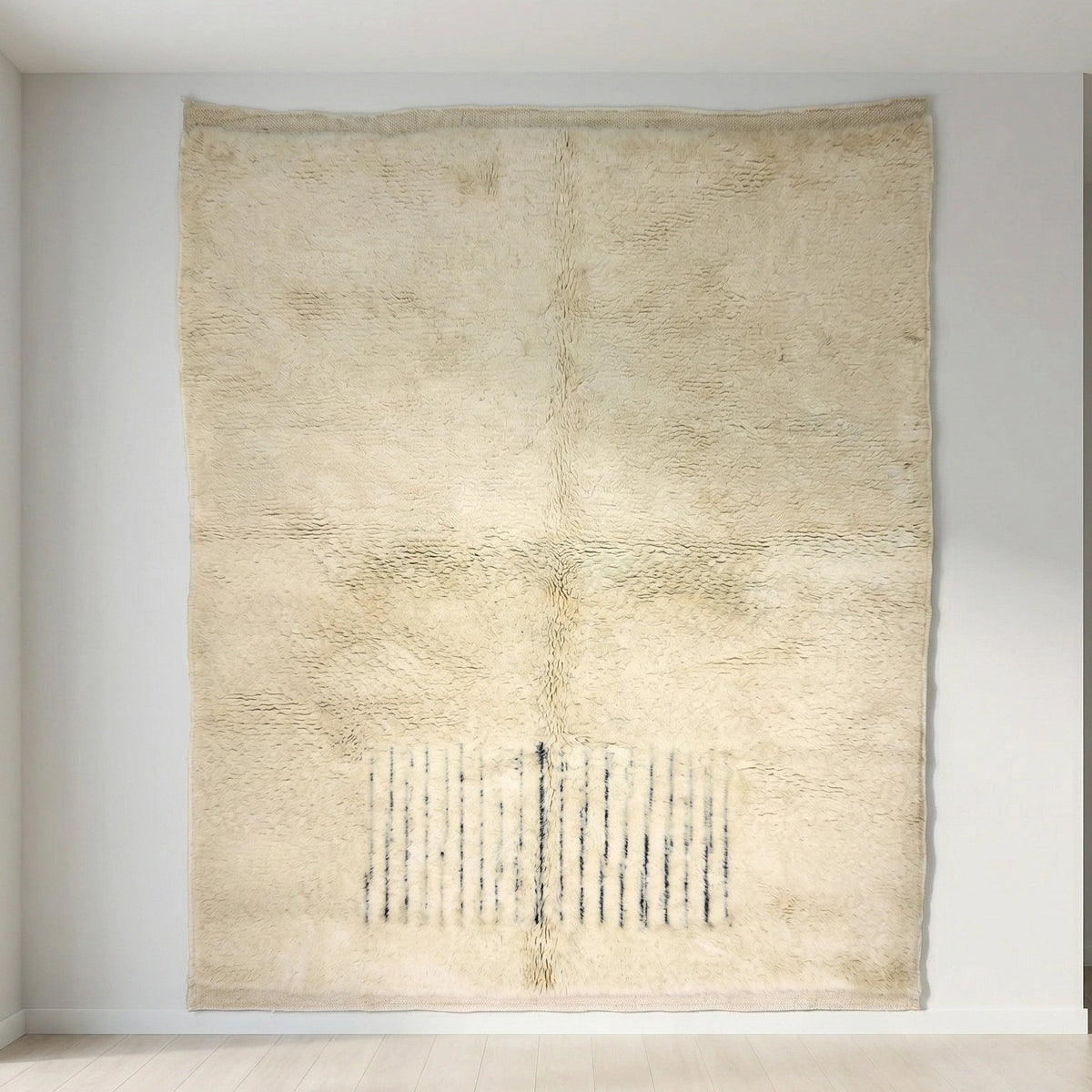 Moroccan wool rug, short dark blue lines near one end of a cream high-pile ground, product view 4