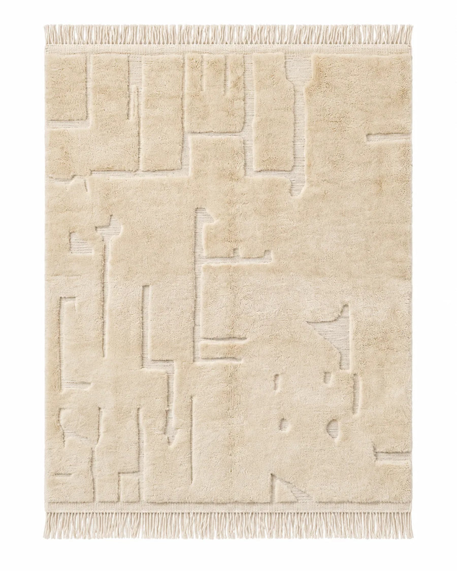 Beni Ourain wool rug, beige tonal pattern formed by changes in pile height in a living room setting