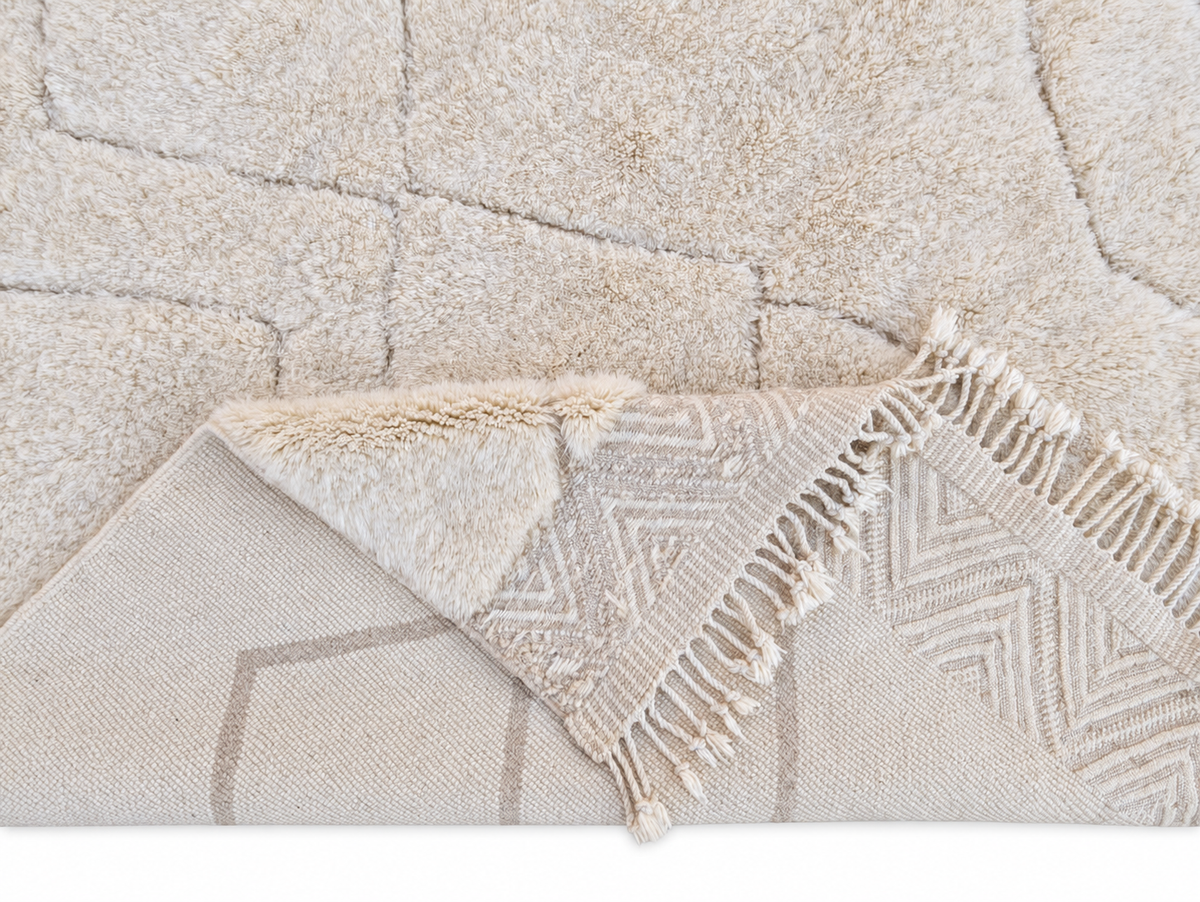 Detail of Cream Beni Ourain Rug with Diamonds and Zigzag Border, 345 × 245 cm.