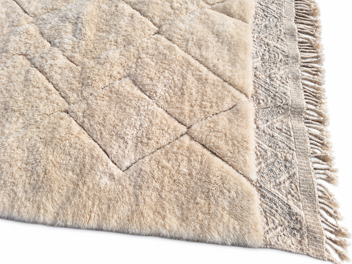 Detail of Cream Beni Ourain Rug with Diamonds and Zigzag Border, 345 × 245 cm.