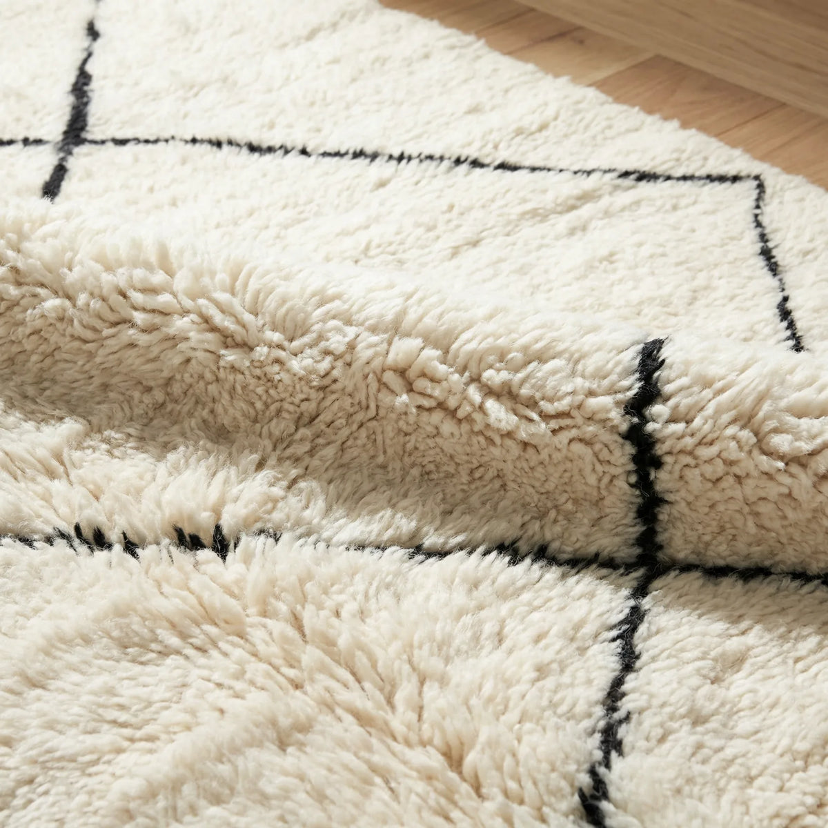 Beni Ourain wool rug, cream ground with a large black diamond lattice, product view 4