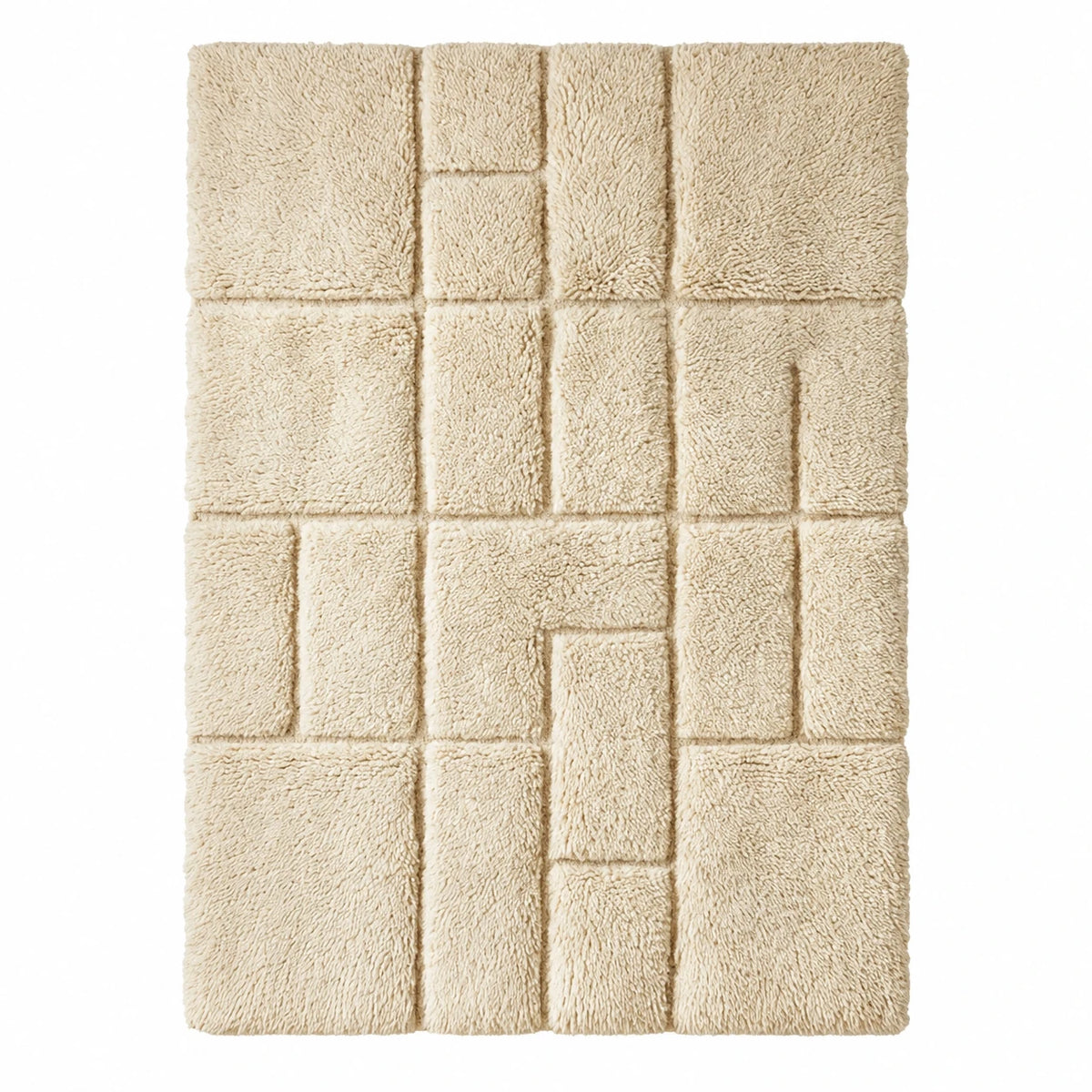 Front view of Beni Ourain wool rug, cream ground with a tonal square relief pattern