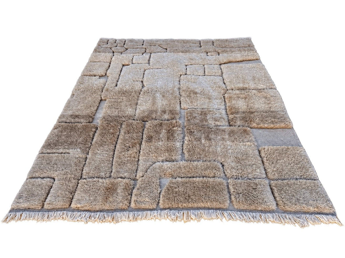Detail of Taupe Beni Ourain Wool Rug with Block Relief, 370 × 283 cm.