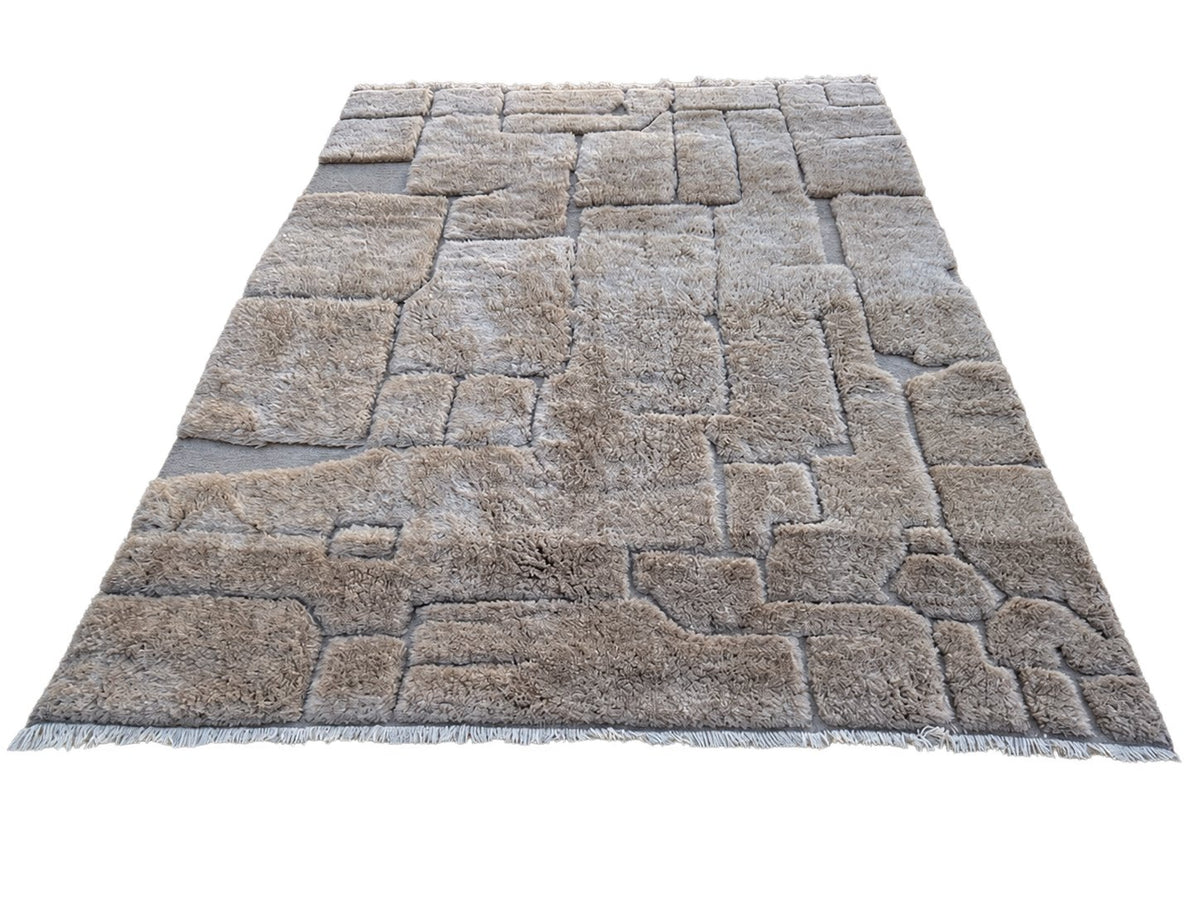 Detail of Taupe Beni Ourain Wool Rug with Block Relief, 370 × 283 cm.