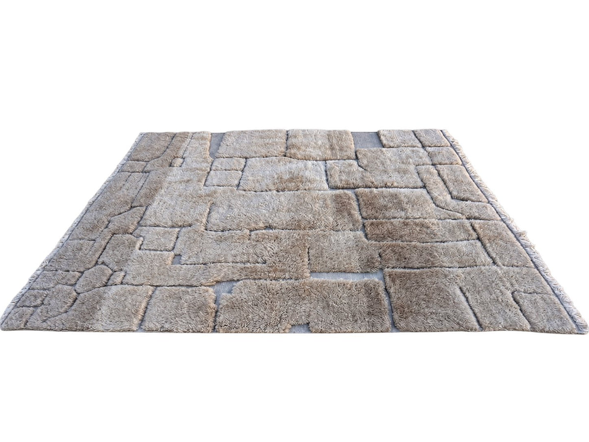 Detail of Taupe Beni Ourain Wool Rug with Block Relief, 370 × 283 cm.