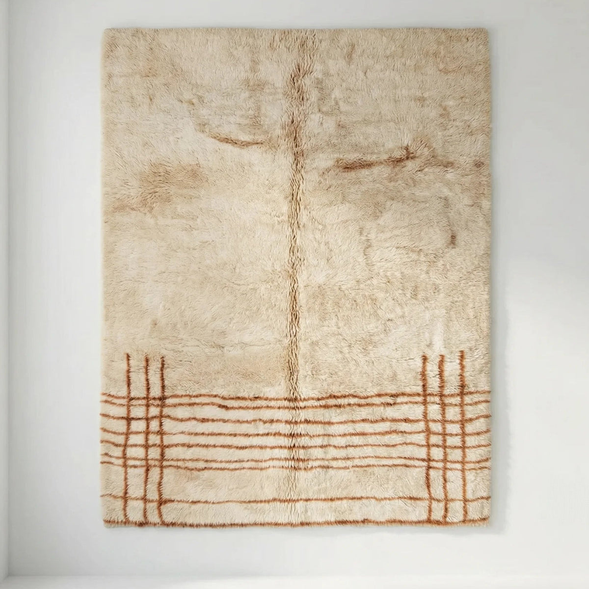 Front view of Beni Ourain wool rug, natural white and pale beige wool with a rust-brown grid