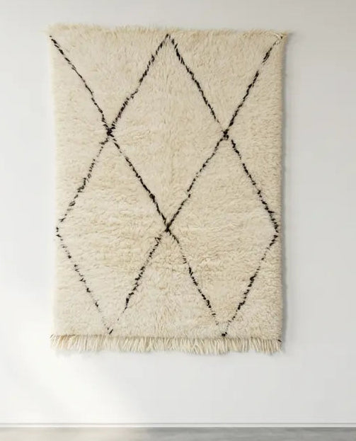 Front view of Beni Ourain wool rug, black diamond outlines on natural white high-pile wool