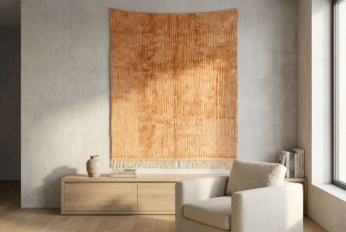 Detail of Moroccan wool rug, warm sand beige ground with a tonal color texture
