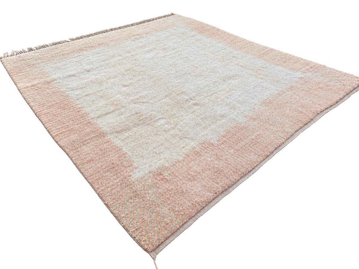 Detail of Cream and Peach Moroccan Rug with Border, 428 × 397 cm.