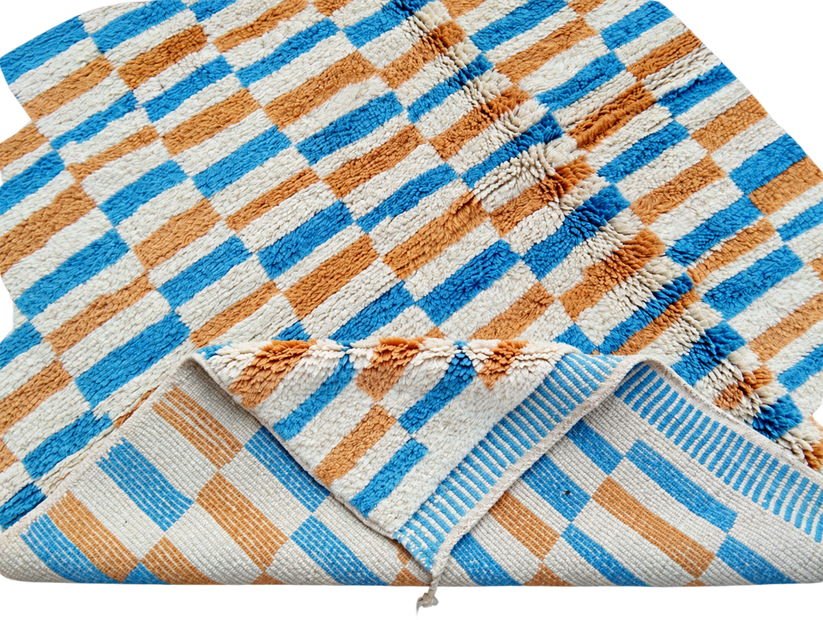 Detail of White, Mustard, and Blue Moroccan Rug with Checks, 305 × 235 cm.