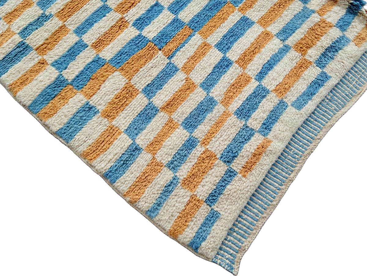 Detail of White, Mustard, and Blue Moroccan Rug with Checks, 305 × 235 cm.
