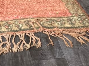Fringe and edge detail of Pink and Green Vintage Moroccan Rug with Star Medallions, 292 × 164 cm.