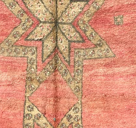 Pattern detail from the original photograph of Pink and Green Vintage Moroccan Rug with Star Medallions, 292 × 164 cm.