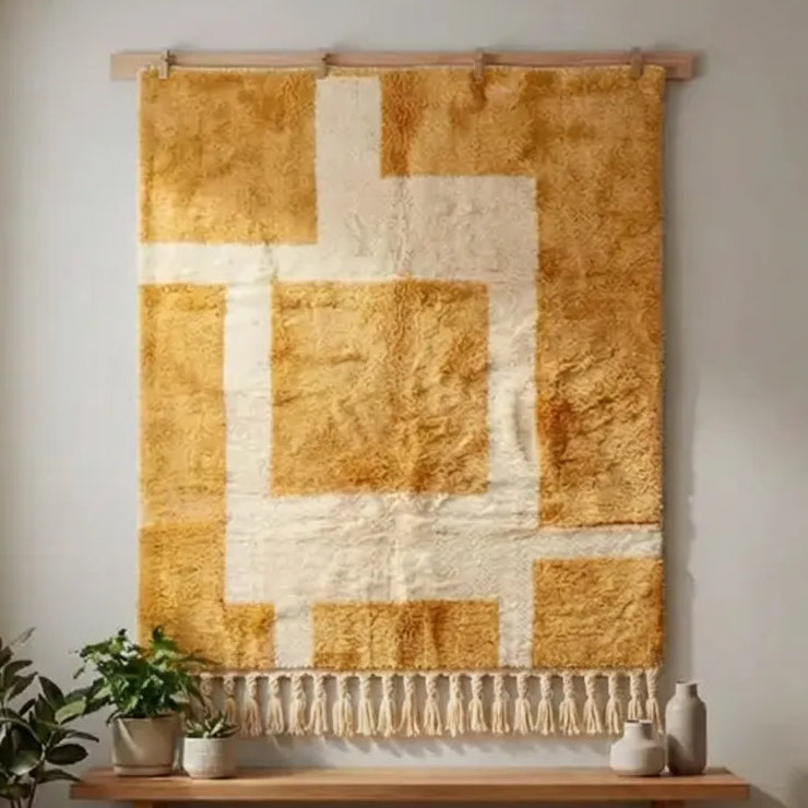 Front view of Moroccan wool rug, large cream frame-like shapes against ochre and mustard yellow