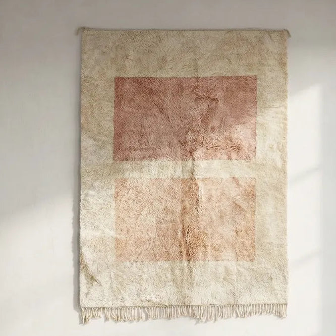 Front view of Mrirt wool rug, pink and peach-beige geometric rectangles on a light ground